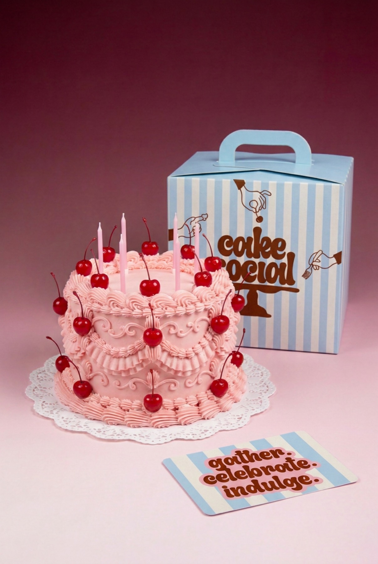 Pink celebration cake with Cake Social packaging