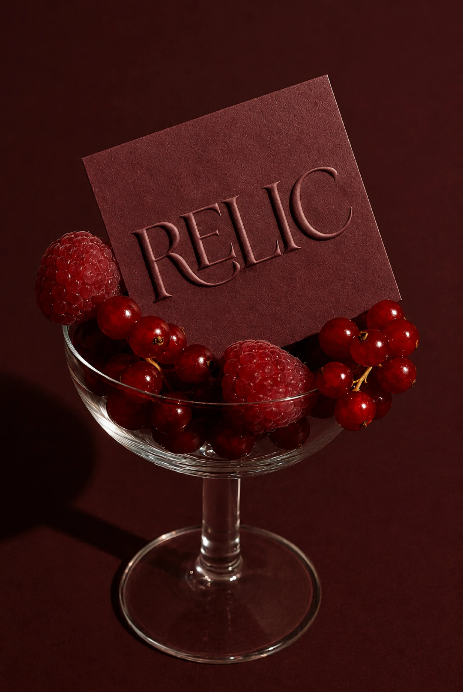 Relic embossed card art direction with red berries